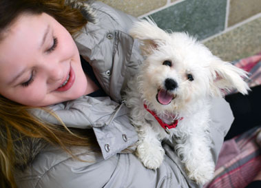 Junior volunteer with dog