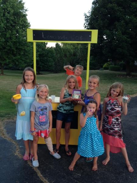 Kids earning money for the animals with a lemonade stand